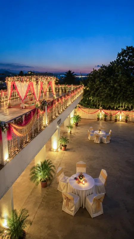 The rooftop at dusk, strung with lights